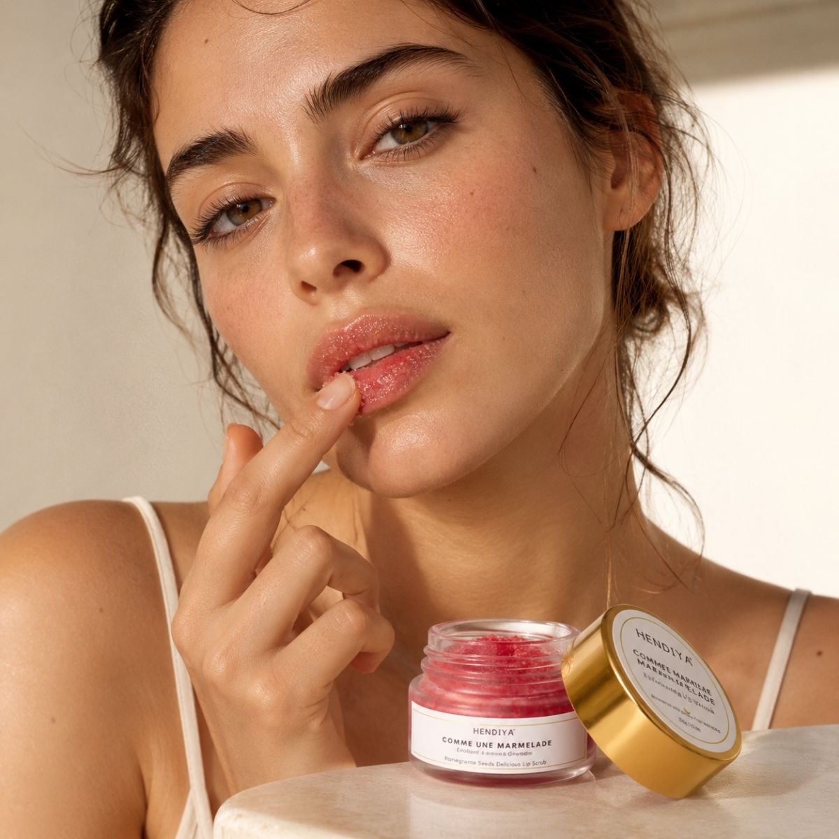 Applying Comme Une Marmelade to the lips