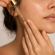 Applying a drop of prickly pear seed oil to the cheek with the Hendiya® dropper